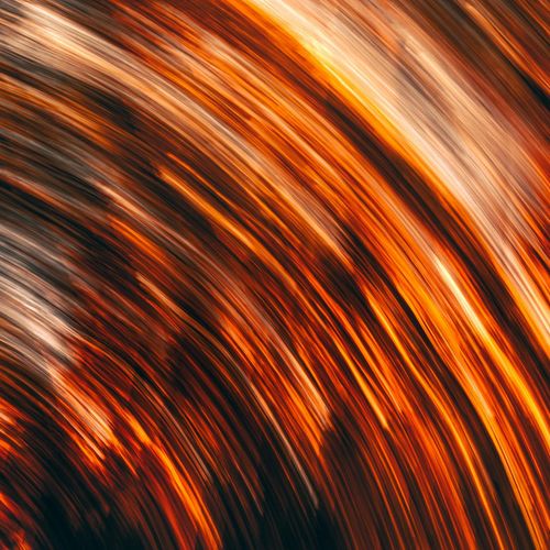 Abstract image representing flow of energy with warm colors.