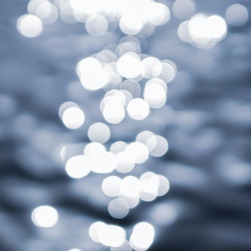 Calm water surface with gentle ripples in soft light.